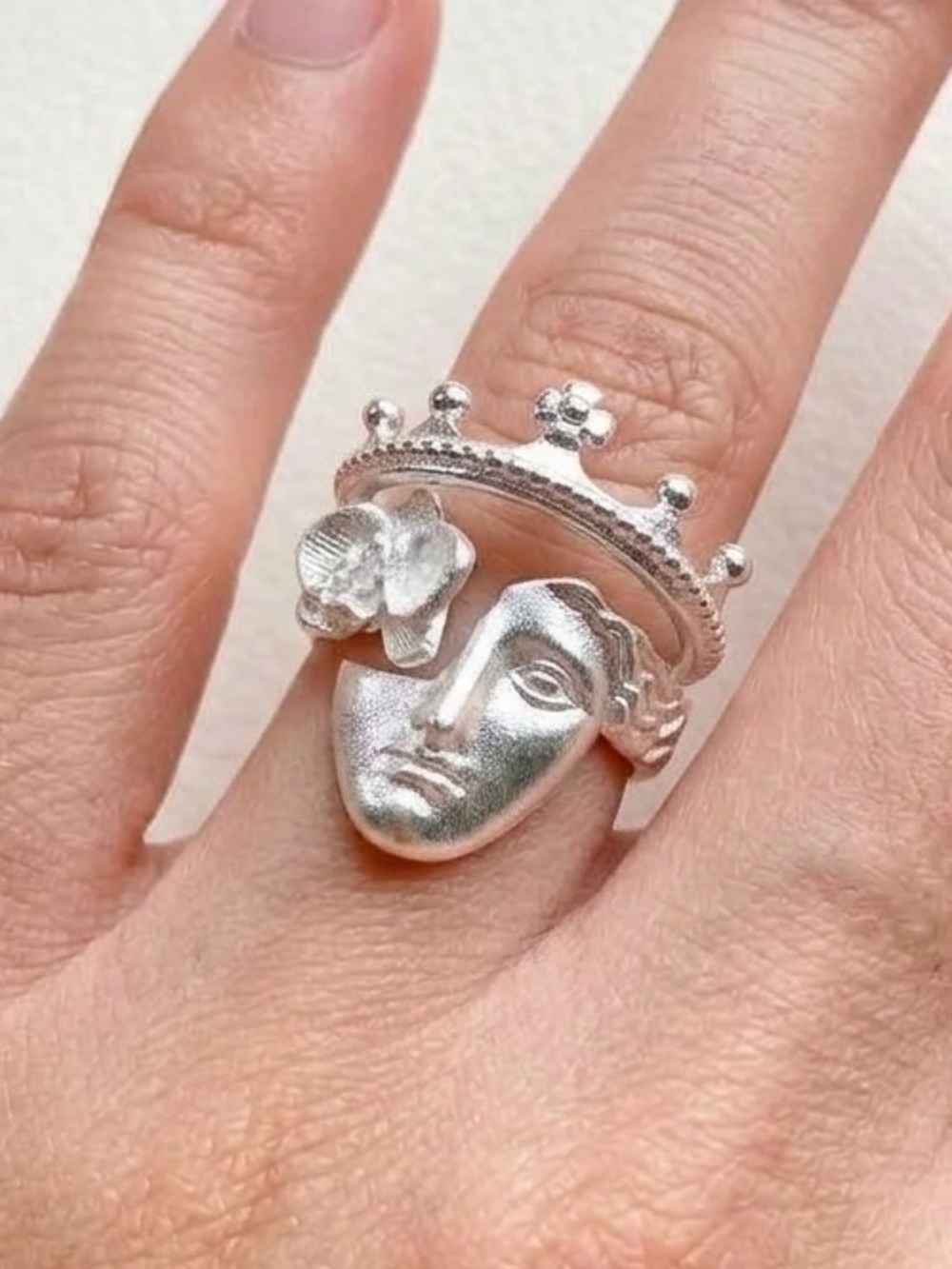 Silver face ring with crown detail